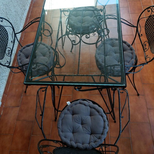 Black wrought iron garden set used with table and 4 chairs