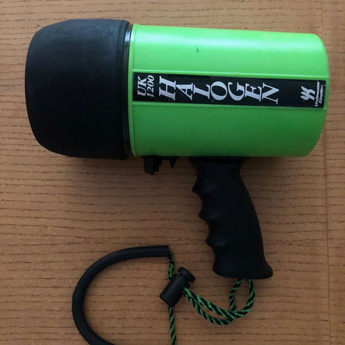 Underwater Kinetics UK1200 halogen underwater flashlight used with handle and strap