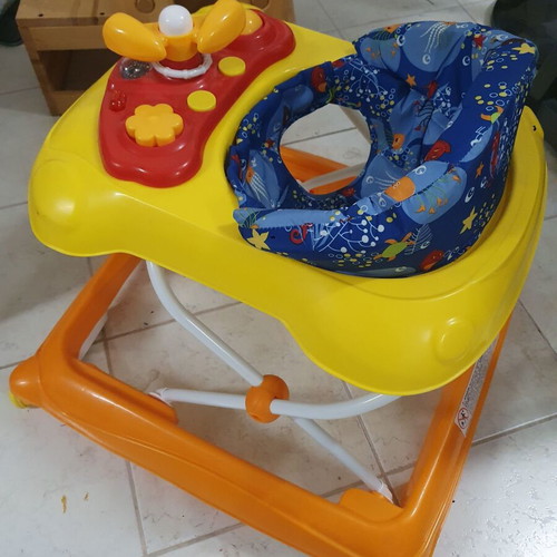 Baby walker like new with toys and comfortable seat