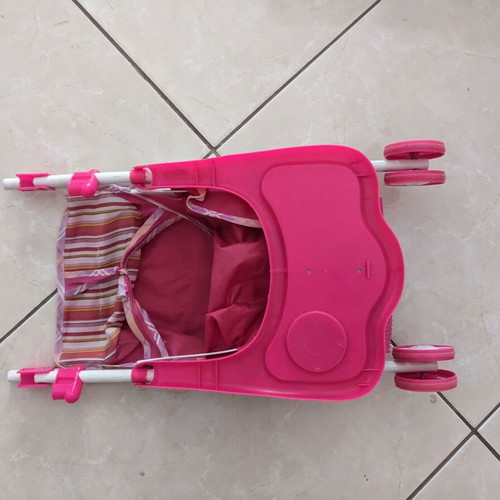 Doll stroller used with wear and fabric tears