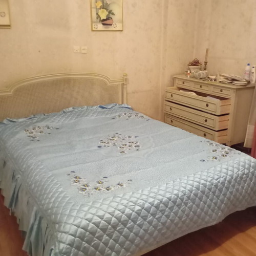 Vintage wooden double bed with wicker headboard, like new, includes slats and mattress