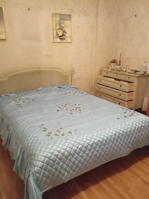 Vintage wooden double bed with wicker headboard, like new, includes slats and mattress