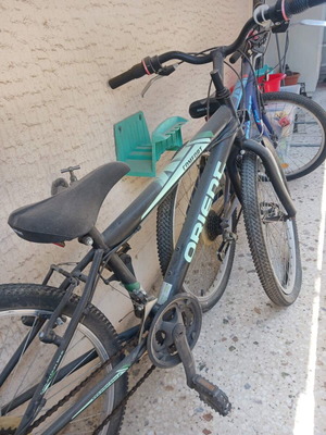 Orient bicycles used, pack of two, 24 inch wheels, black and blue