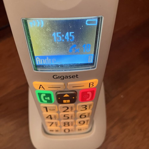 Cordless landline telephone with big numbers used, white