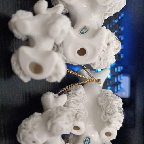 Porcelain poodle figures like new, mother, father and puppies