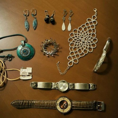Jewelry set used with earrings, bracelets, pendants, brooch, and watches