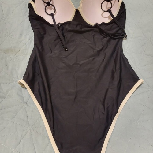 One-piece swimsuit like new, black with white details and rings, size M