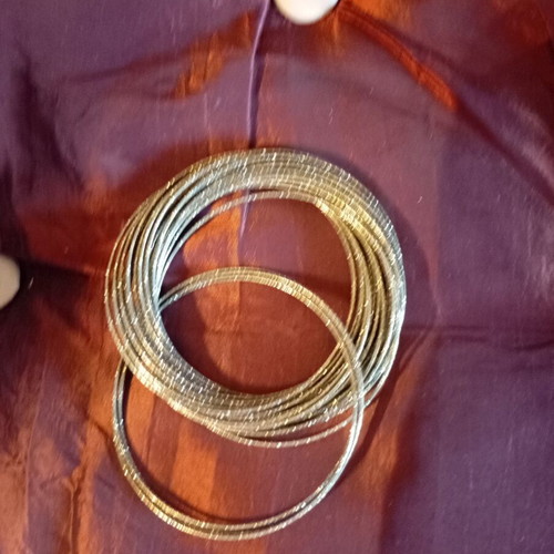 Bracelet made of 32 thin metal pieces like new, gold tone