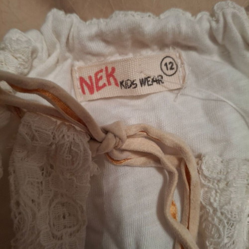 White blouse for girl 12 years new with embossed texture and open back