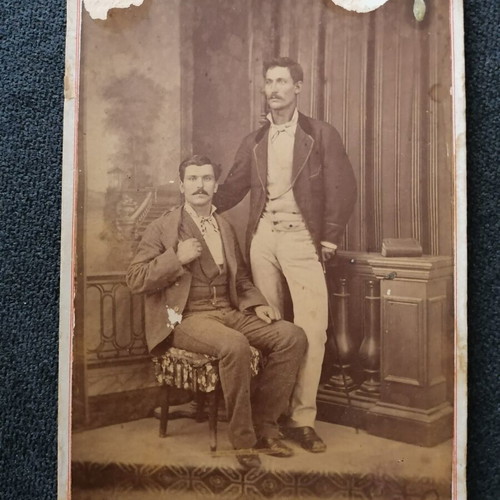 Photograph used, thick cardboard with damages