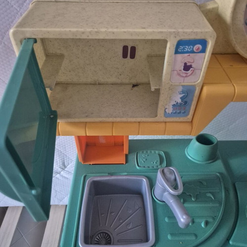 Fisher Price children's play kitchen with microwave and washing machine