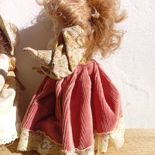 Porcelain dolls used, set of two 21 and 18 cm