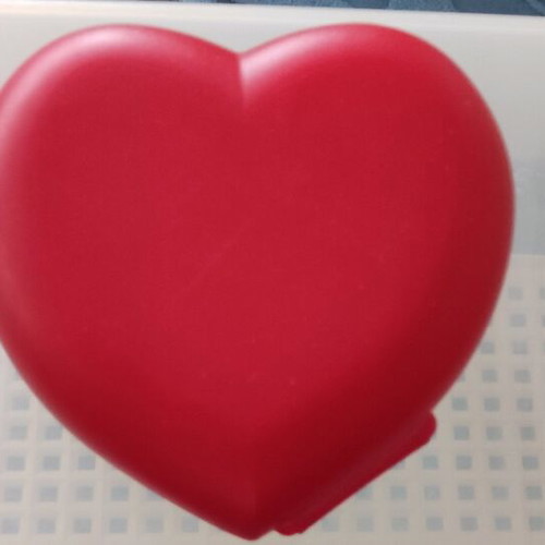 Tupperware heart-shaped food container like new
