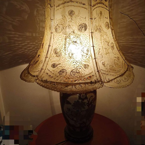 Porcelain lamp used with embossed leather cover