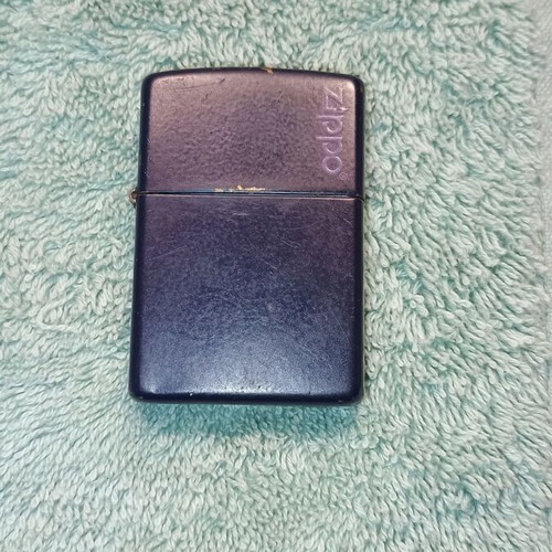 Zippo lighter used blue with purple logo