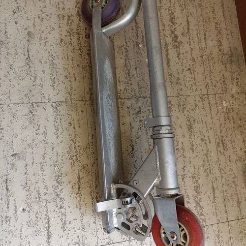 Silver metal scooter used, lightweight and foldable