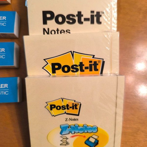 Office supplies new with sticky notes, erasers and sharpeners