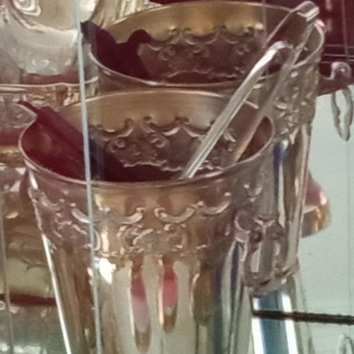 Silver-plated vintage ice bucket used with tongs