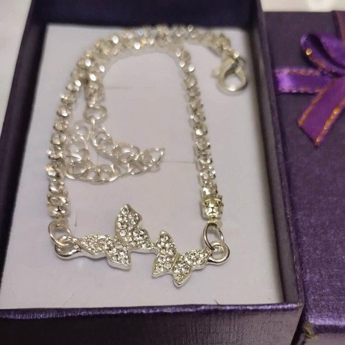 Bracelet with shiny butterflies new, white and silver
