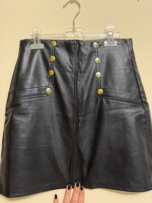 Black mini leather look skirt S/M like new with decorative buttons