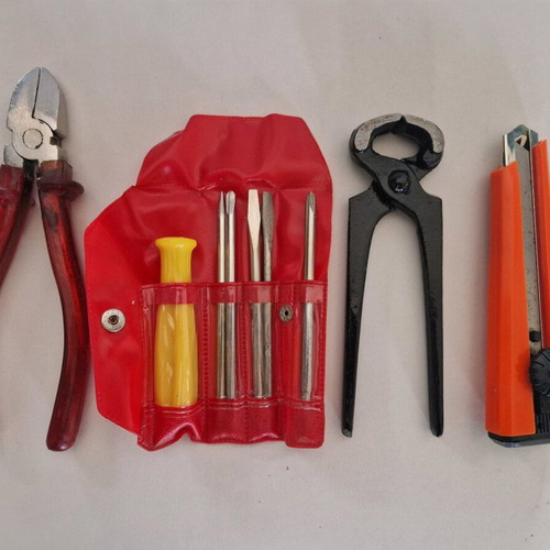 Tool set new with pliers, electrician side cutter, folding knife and screwdrivers