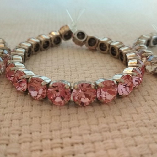 Set of three tennis bracelets like new, pink and white