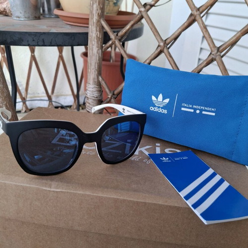 Adidas sunglasses used, black matte with blue mirror lens