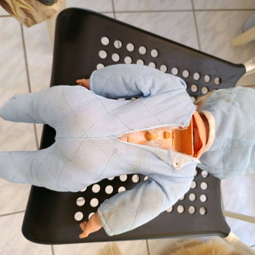 Vintage baby doll used with missing parts and wear