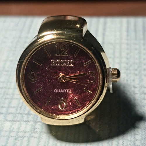 Quartz ring watch like new with purple dial and gold bracelet