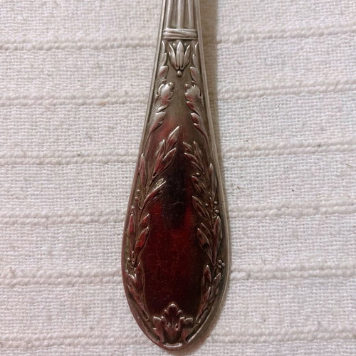 Vintage silver-plated food fork used with embossed decoration