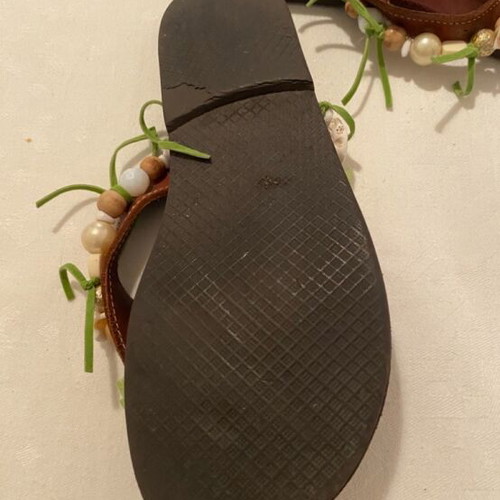 Leather slippers like new, decorated with beads and green ribbons, size 36