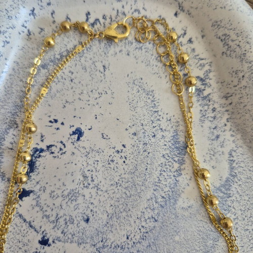 Gold double rosary-style necklace with cross, stainless steel