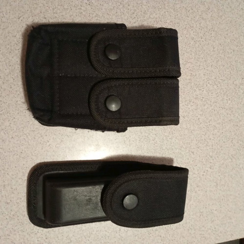 Pistol magazine holders used, one single and one double, black