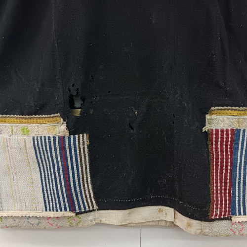 Traditional collectible wool dress used with wear due to age