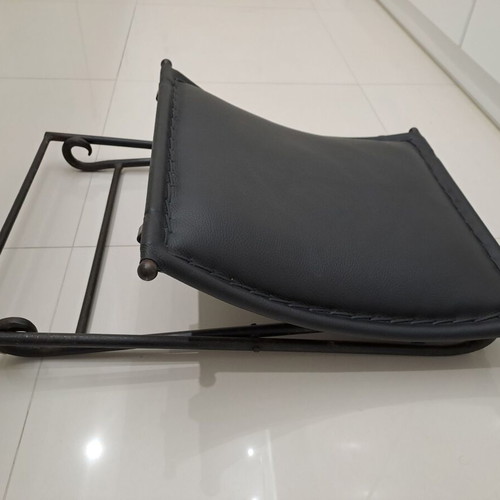 Leather footstool like new, black with cast iron frame