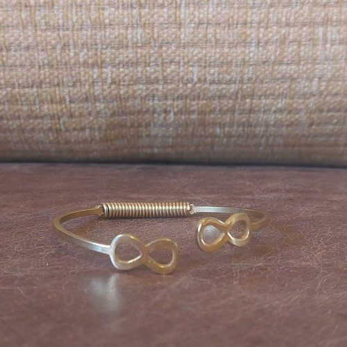 Gold infinity handcuff bracelet like new