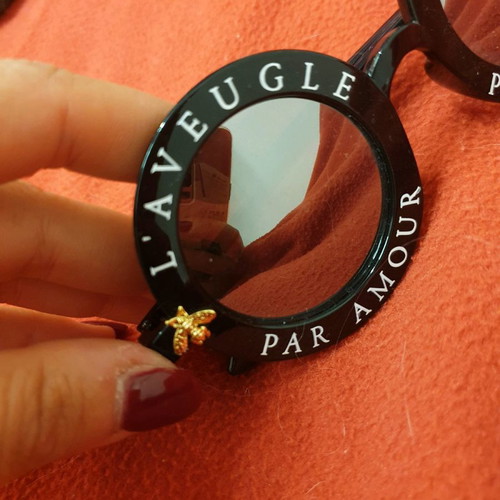 Round modern sunglasses new, black with gold detail