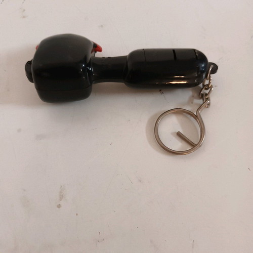 Axe keychain like new, makes sound when hit, black