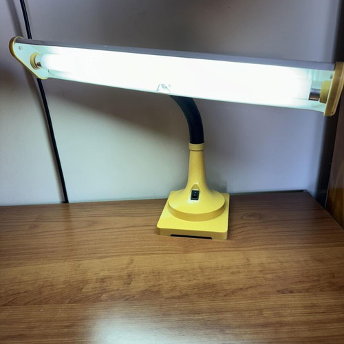 Yellow vintage desk lamp with flexible neck