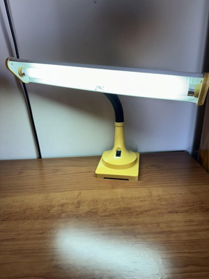 Yellow vintage desk lamp with flexible neck