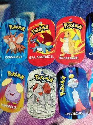Pokémon metal tags 2006 like new, set of 10