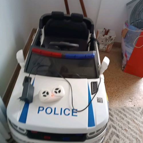 Children's police toy car like new with charger and remote control