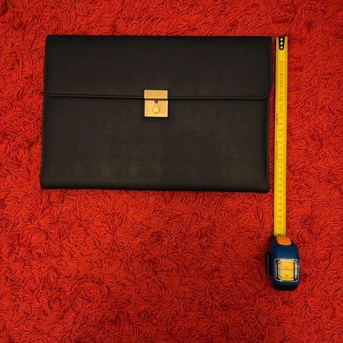 Clutch used, black with gold clasp, leatherette material