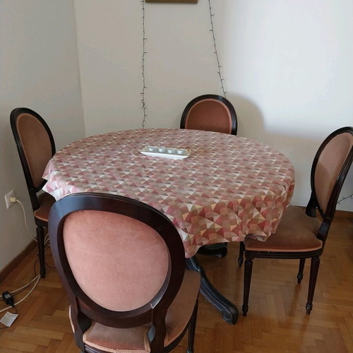 Wood-carved round table with 4 chairs like new
