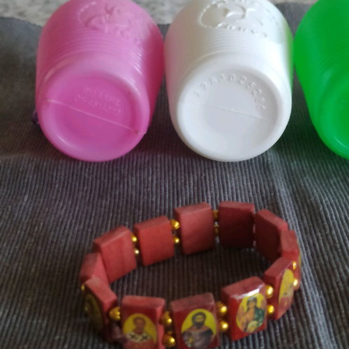 Bracelet with saints and holy water bottles pack used