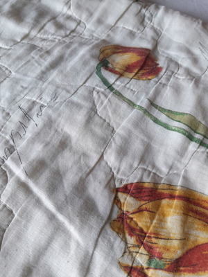 Single quilt used, white with floral patterns