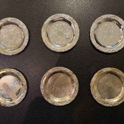 Silver-plated carved coasters like new