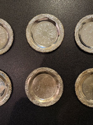Silver-plated carved coasters like new