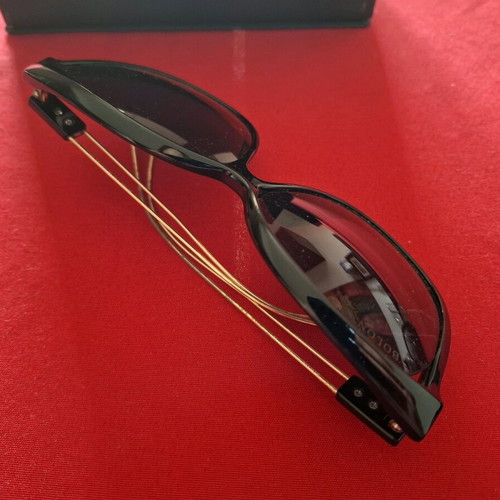 Black sunglasses with gold detail