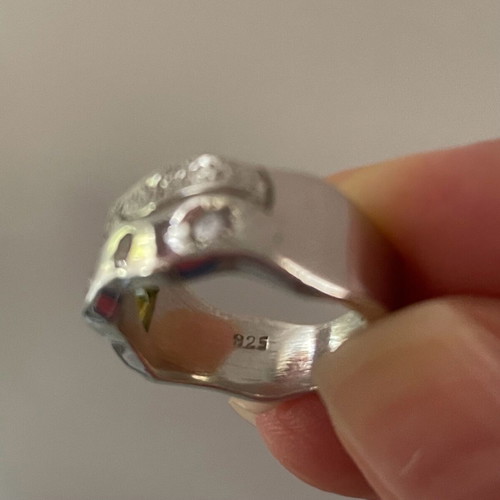 Silver ring with white and yellow zircon used